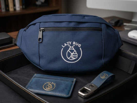 Blue waist bag with 'Lazy Bug' logo on a desk with accessories